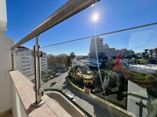a view of a city from a balcony at Albufeira Town Apartment With Pool by Homing in Albufeira