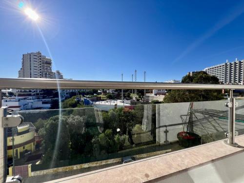a view of a city from a balcony at Albufeira Town Apartment With Pool by Homing in Albufeira