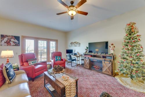 a living room with a christmas tree in it at 1 Mi to Skiing Mtn-View Condo in Angel Fire! in Angel Fire