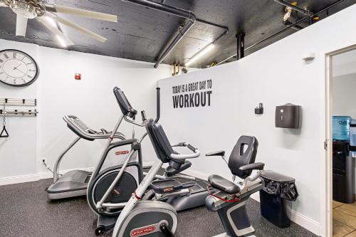 a gym with three exercise bikes next to a wall at Islander W 602 in Fort Walton Beach