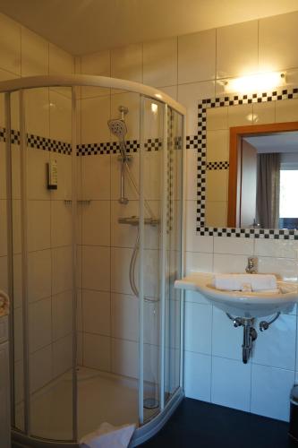 a bathroom with a shower and a sink at Ferienhaus Bucheggerhof in Schladming
