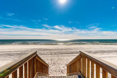 a view of the beach from a wooden boardwalk at Islander W 703 in Fort Walton Beach