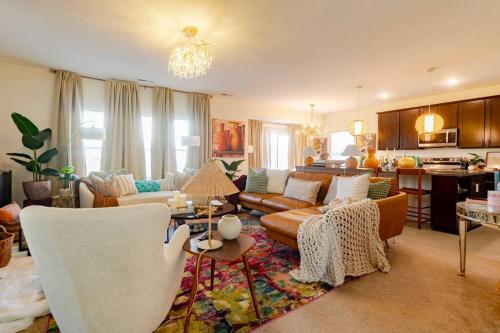 a living room with a couch and a table at Luxury Beautiful Spacious Retreat Getaway in Columbus