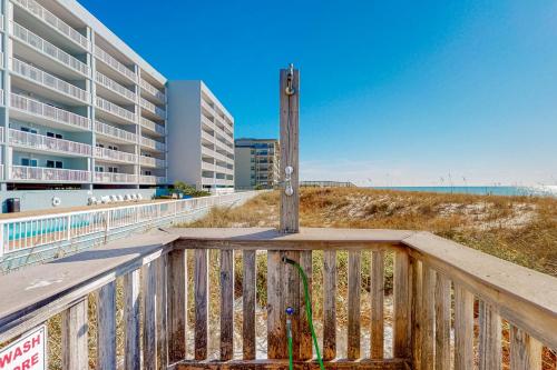 a pole on a boardwalk next to a beach at Islander E 4009 in Fort Walton Beach
