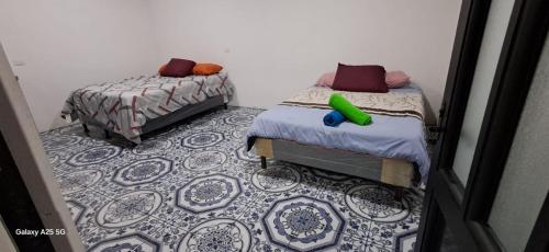 Кровать или кровати в номере Axel Casa