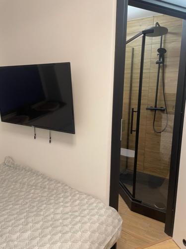 Ένα ή περισσότερα κρεβάτια σε δωμάτιο στο Cute apartament