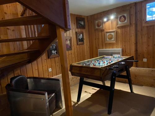 a room with a chessboard on a table in a room at Alpe d'Huez Houses - Chalet Justine - Duplex for up to 15 people amazing location in L'Alpe-d'Huez