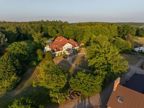 an aerial view of a house in the woods at Gut Groß Zecher - Ferienzimmer in Seedorf