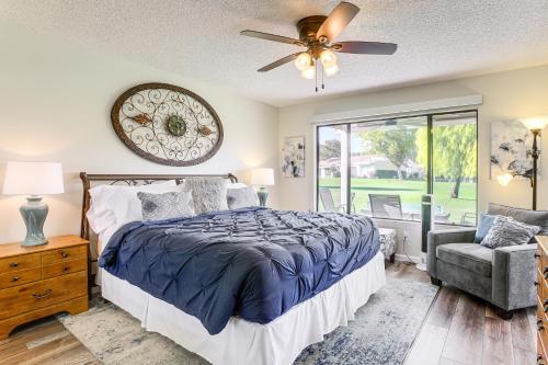 a bedroom with a bed and a ceiling fan at Golf Course On-Site Peaceful Condo in Palm Desert in Palm Desert