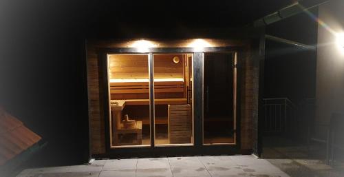 a glass door with lights on top of it at Gasthof-Pension Ölberger in Wolfsberg