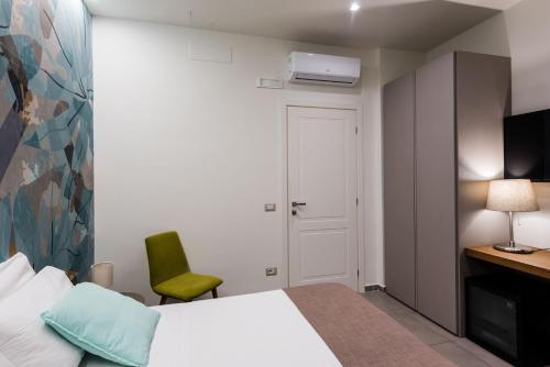 Postel nebo postele na pokoji v ubytování BeBIGEA Rooms