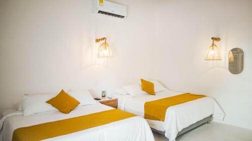 Postel nebo postele na pokoji v ubytování Wala beach club