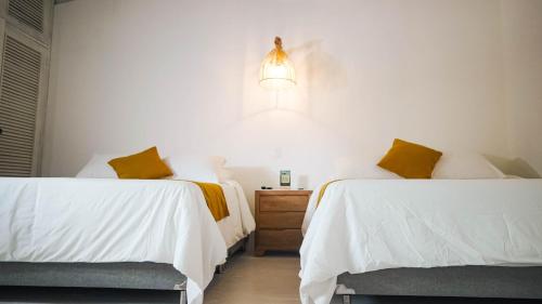 Postel nebo postele na pokoji v ubytování Wala beach club