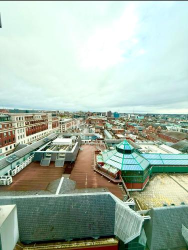 a view of a city from the roof of a building at Winners of 2025 traveller Award, Elegant two bedroom city central apartment with Netflix & WiFi in Leeds
