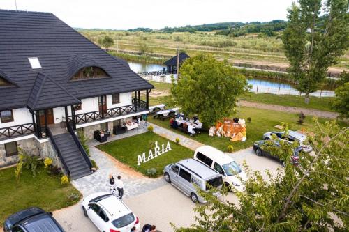 an aerial view of a house with cars parked outside at Casa Andra in Siret
