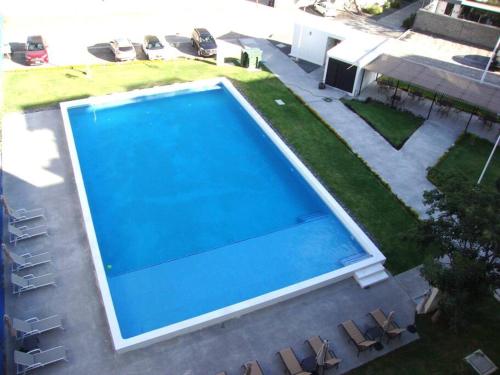 an overhead view of a large blue swimming pool at Condo PH Lago Luna, Chante in Chantepec