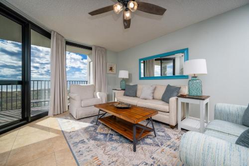 a living room with a couch and a table at Phoenix VI 6312 in Orange Beach