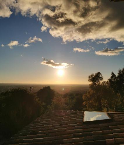 a view of the sunset from the top of a building at Villa Dei Romani - Country House in Guidonia