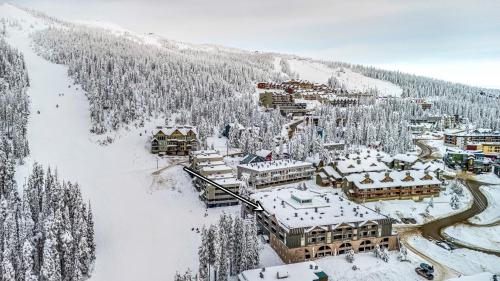an aerial view of a resort in the snow at Winter Escape On Perfection - Ski In Out, Pool & Hot Tub in Big White