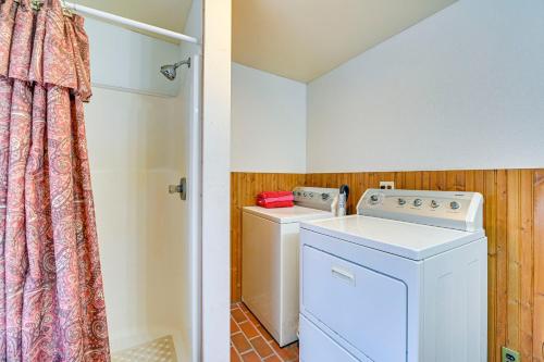 a laundry room with a washer and dryer at Lanesville Home with Pool Table, Bar and Deck! in Lanesville