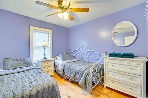 a bedroom with two beds and a ceiling fan at Lanesville Home with Pool Table, Bar and Deck! in Lanesville