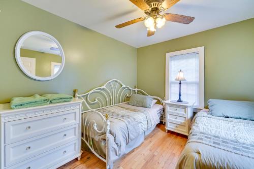 a bedroom with two beds and a mirror at Lanesville Home with Pool Table, Bar and Deck! in Lanesville