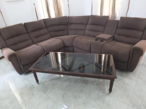 a living room with a couch and a coffee table at Tanamera Estate Weligama in Weligama