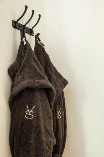 a towel hanging on a wall with two handles at Villa Shepherd Zanzibar - LUXURY BEACH FRONT - KIWENGWA in Kumba Urembo