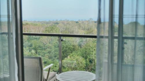 a view of a table and chairs from a window at RIMBA by AYANA Bali in Jimbaran