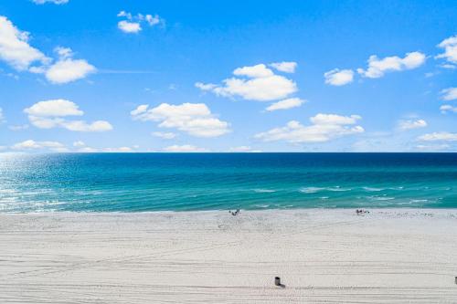 a view of the ocean with people on the beach at Sandpiper Beacon Beach Resort in Panama City Beach