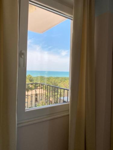 a window with a view of the ocean at PROMO Cozy Apartments in Golem