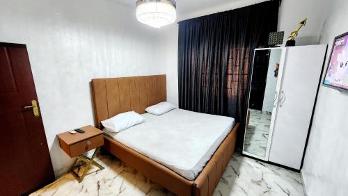 Postel nebo postele na pokoji v ubytování CG Apartments