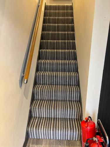 an empty flight of stairs with a fire hydrant at Sutherland mini apartments in Fort William