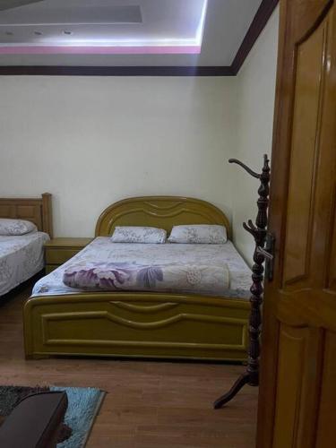 a bedroom with a bed in a room at Eagles Nest Muzaffarabad in Muzaffarabad