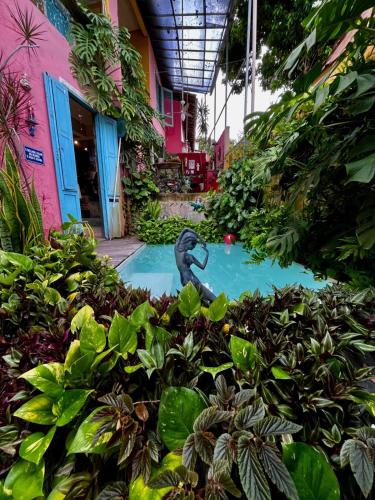 a swimming pool in the middle of a garden at Hospedaria Santa Bárbara in Rio de Janeiro