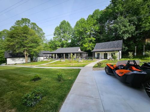 a motorcycle parked on a sidewalk in front of a house at Life's Good Retreat in Brevard