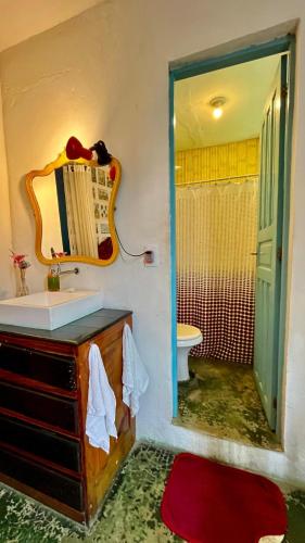a bathroom with a sink and a mirror at Hospedaria Santa Bárbara in Rio de Janeiro