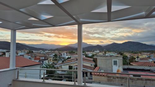 a view of a city from a balcony at COMIDA Guesthouse & Experiences in Tortolì