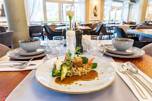 a plate of food on a table in a restaurant at Hotel Fero Express POKOJE KLIMATYZOWANE AC in Kraków