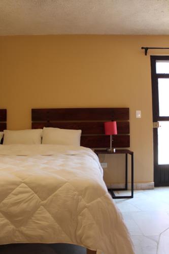 Cama o camas de una habitación en Hotel Camino de Allende