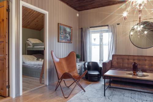 a living room with a couch and a table at Yttervik in Mo i Rana