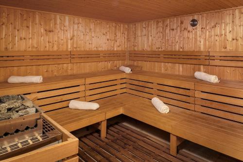 a sauna with wooden benches and towels in it at Ocean Eden Bay - Adults Only - All Inclusive in Falmouth