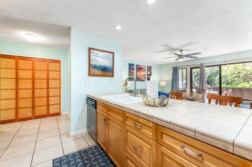 a kitchen with a sink and a counter top at Your Maui Getaway-Walk to the Beach, Pool, Hot Tub LSV14 in Kihei
