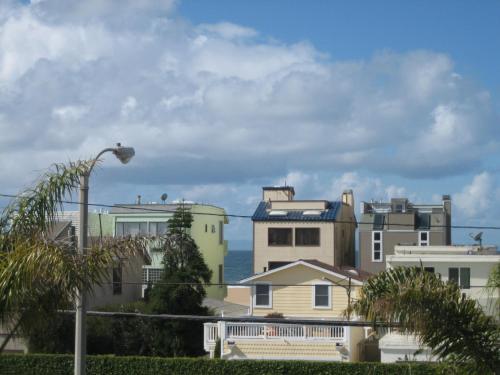 a group of houses with the ocean in the background at OceanView Motel in Huntington Beach