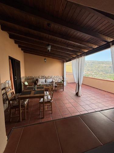 a living room with a table and a couch at Vv Las Vistas in Icod de los Vinos