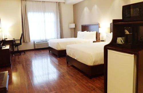 Cama o camas de una habitación en Days Inn & Suites by Wyndham Fort Saskatchewan