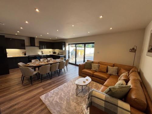 a living room with a couch and a table at Lyla's at Botany Bay in Broadstairs