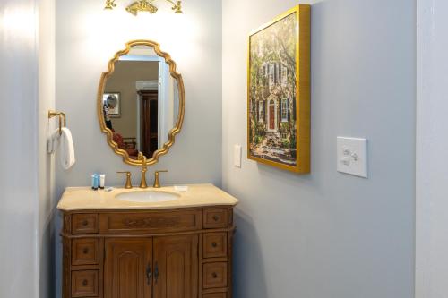 a bathroom with a sink and a mirror at Eliza Thompson House, Historic Inns of Savannah Collection in Savannah