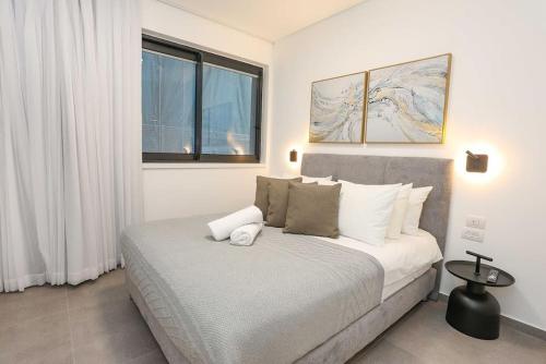 Postel nebo postele na pokoji v ubytování Luxury Garden 1bed Apartment