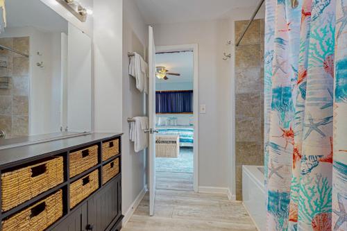 a bathroom with a sink and a shower at OIB28 Summer Sands in Ocean Isle Beach